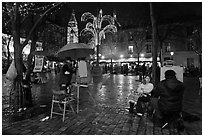 Place du Tertre by night with Christmas lights, Montmartre. Paris, France (black and white)