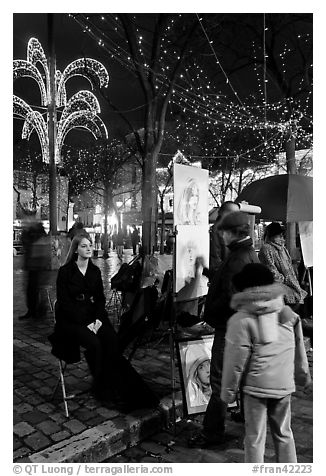 Portraitist at work, Place du Tertre, Montmartre. Paris, France (black and white)