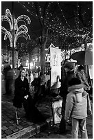 Portraitist at work, Place du Tertre, Montmartre. Paris, France (black and white)