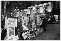 Art for sale on Place du Tertre at night, Montmartre. Paris, France ( black and white)