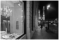 Luxury storefront and Place Vendome column by night. Paris, France ( black and white)