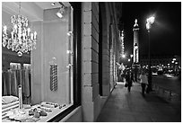 Luxury storefront and Place Vendome column by night. Paris, France (black and white)