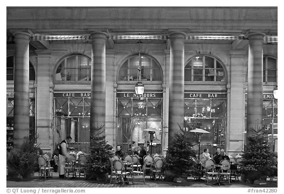 Arcades and Cafe by night. Paris, France