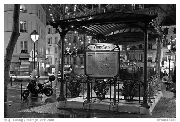 Subway entrance with art deco canopy by night. Paris, France