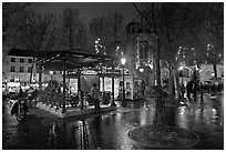 Public square on rainy night. Paris, France (black and white)