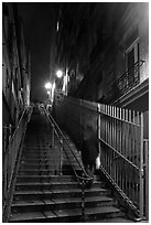 Woman climbing steep steps to the Butte, Montmartre. Paris, France ( black and white)