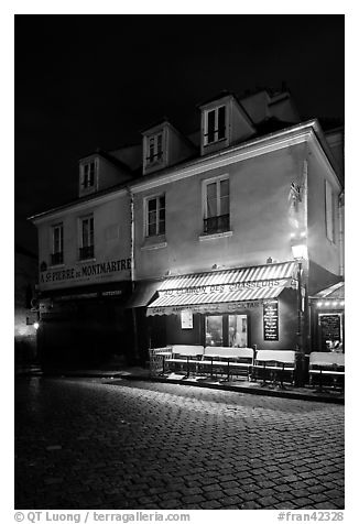 Houses with restaurant at street level, Montmartre. Paris, France (black and white)