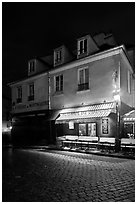 Houses with restaurant at street level, Montmartre. Paris, France (black and white)