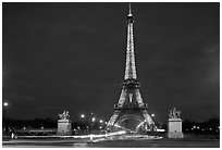 Eiffel Tower seen across Iena Bridge at night. Paris, France (black and white)