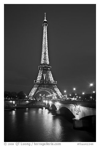 Seine River, Iena Bridge, and illuminated Eiffel Tower. Paris, France