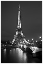 Seine River, Iena Bridge, and illuminated Eiffel Tower. Paris, France (black and white)