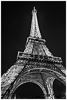 Illuminated  Eiffel Tower seen from close. Paris, France (black and white)