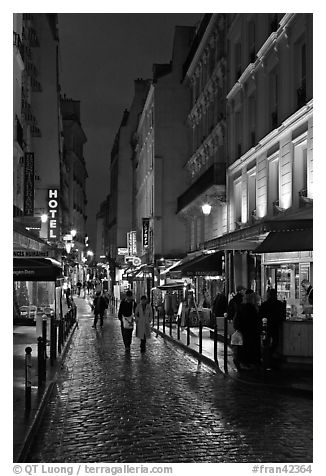 Pedestrian street with restaurants at night. Quartier Latin, Paris, France (black and white)