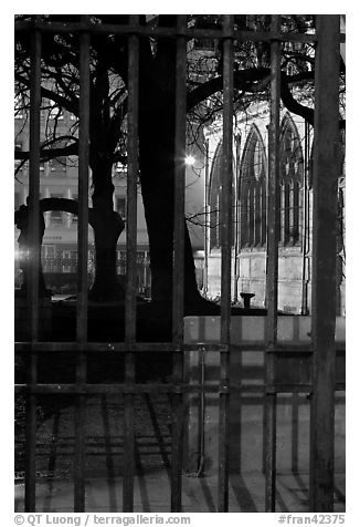 Cluny thermes behind iron grids by night. Quartier Latin, Paris, France (black and white)