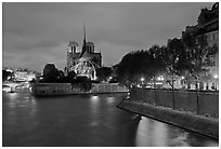 Banks of the Seine River, Ile de la Cite, Ile Saint Louis, and Notre Dame at twilight. Paris, France (black and white)