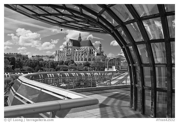 Curvy modern structure framing the church of Saint-Eustache. Paris, France (black and white)