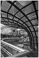 Curvy glass and metal structure framing historic Saint-Eustache church. Paris, France (black and white)