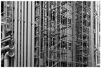 Exposed skeleton of brightly colored tubes, Pompidou Centre. Paris, France (black and white)