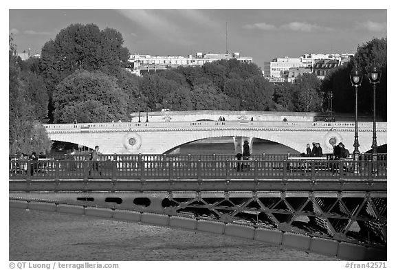 Steel and stone bridges over the Seine River. Paris, France