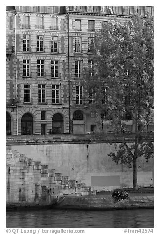 Quay and riverfront buildings on banks of the Seine. Paris, France (black and white)