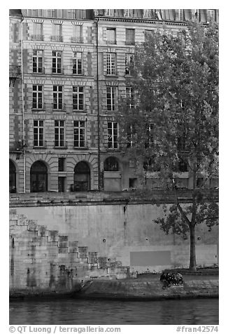 Quay and riverfront buildings on banks of the Seine. Paris, France