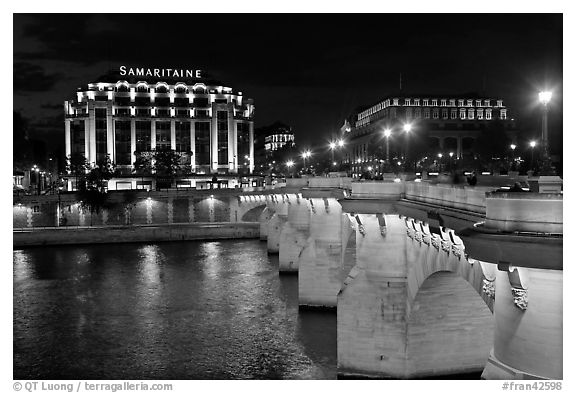 Pont Neuf and Samaritaine illuminated at night. Paris, France