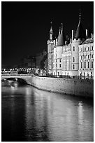 Conciergerie reflected in Seine river at night. Paris, France (black and white)