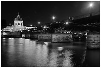 Institut de France, Pont des Arts and Seine reflections at night. Paris, France (black and white)