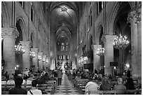 Interior of Notre-Dame de Paris during mass. Paris, France ( black and white)