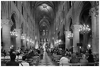 Interior of Notre-Dame de Paris during mass. Paris, France (black and white)