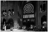 Bishop celebrating mass, South transept, and stained glass rose. Paris, France (black and white)