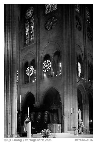 Cardinal reading and choir of Notre-Dame cathedral. Paris, France (black and white)