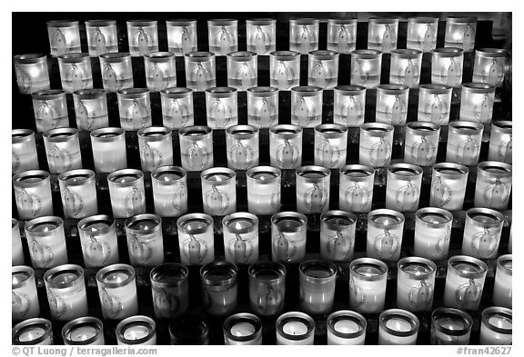 Array of candles, Notre-Dame cathedral. Paris, France (black and white)