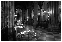 North Aisle and candles, cathedral Notre-Dame-de-Paris. Paris, France (black and white)