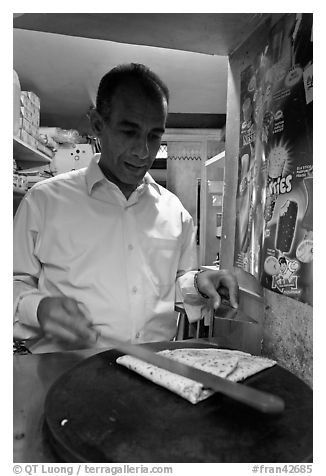 Man preparing a crepe, Montmartre. Paris, France (black and white)