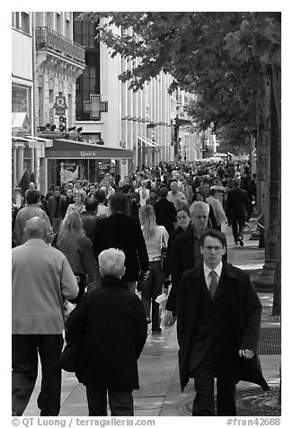 Dense pedestrian traffic on Champs-Elysees. Paris, France (black and white)