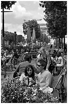 Couple at outdoor cafe on the Champs-Elysees. Paris, France (black and white)