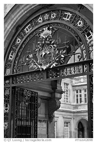 Gate and emblem of the city of Paris, Carnevalet Museum. Paris, France (black and white)