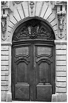 Ancient wooden door, le Marais. Paris, France (black and white)