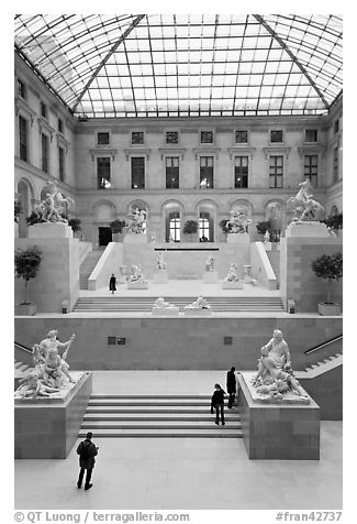 Visitors and exhibit inside Louvre museum. Paris, France