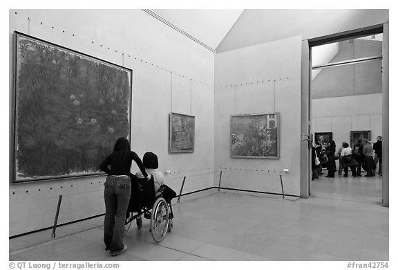 Tourist in wheelchair, Orsay Museum. Paris, France (black and white)