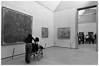 Tourist in wheelchair, Orsay Museum. Paris, France ( black and white)