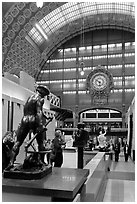 Sculpture and historic clock inside Orsay Museum. Paris, France ( black and white)