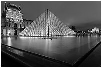 IM Pei Pyramid and reflection ponds at night, The Louvre. Paris, France (black and white)