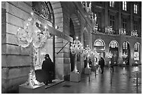 Looking at the storefronts of luxury stores at night, Place Vendome. Paris, France ( black and white)