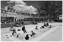 Children playing in sandbox, Place des Vosges. Paris, France ( black and white)