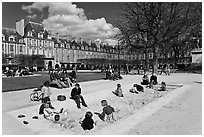 Children playing in sandbox, Place des Vosges. Paris, France (black and white)