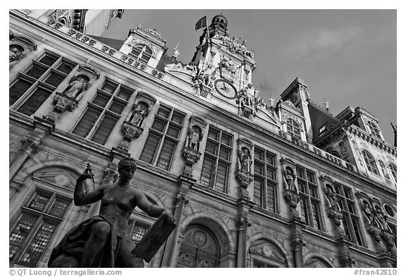 Statue Science by Jules Blanchard and Hotel de Ville at sunset. Paris, France