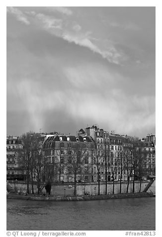 Riverfront houses on Ile Saint Louis with rainbow. Paris, France (black and white)