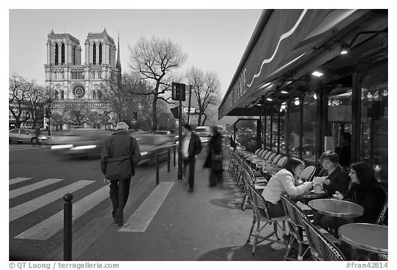 Cafe, street, and Notre Dame at dusk. Quartier Latin, Paris, France (black and white)